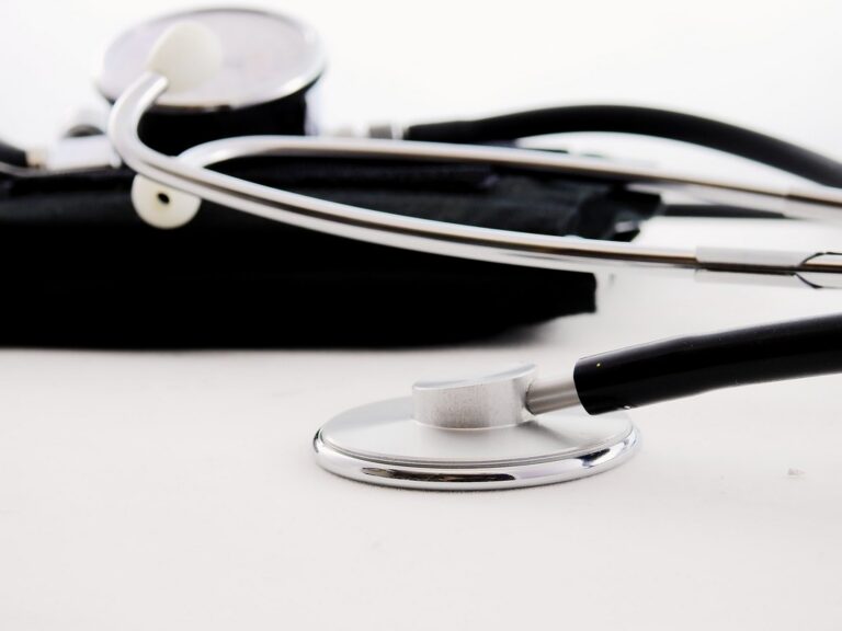 Silver stethoscope on a clean white surface in a medical office