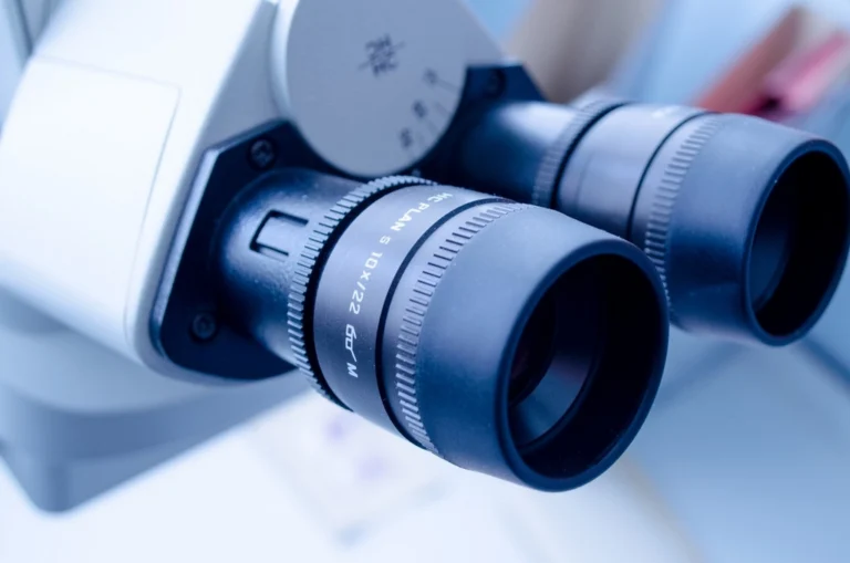 Close up of a modern laboratory microscope in a bright lab
