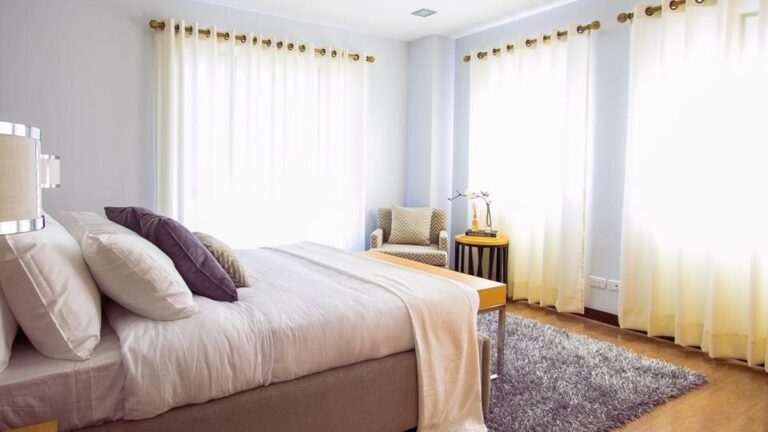 Calm, tidy bedroom with soft morning light, set up for restful sleep
